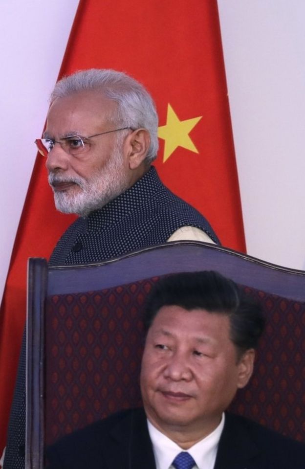 ndian Prime Minister Narendra Modi walks past Chinese President Xi Jinping after delivering his statement at the end of the BRICS summit in Goa, India, Sunday, Oct. 16, 2016.