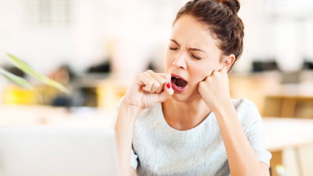 Woman yawning