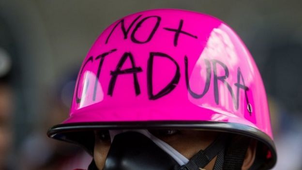 A man with a message in his helmet that reads 