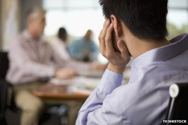 Back of man's head in meeting
