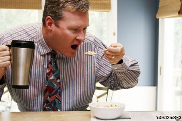 Man eating breakfast in a hurry