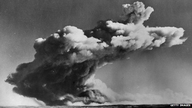 A drifting mushroom cloud hangs over the Monte Bello Islands off Western Australia, after Britain's first atomic bomb is tested