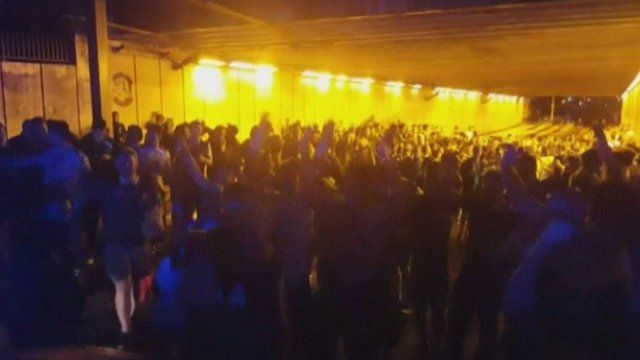 BBC News NI cameraman Phil Hilditch took this footage of a verbal exchange between a French police officer and Irish fans in Bordeaux