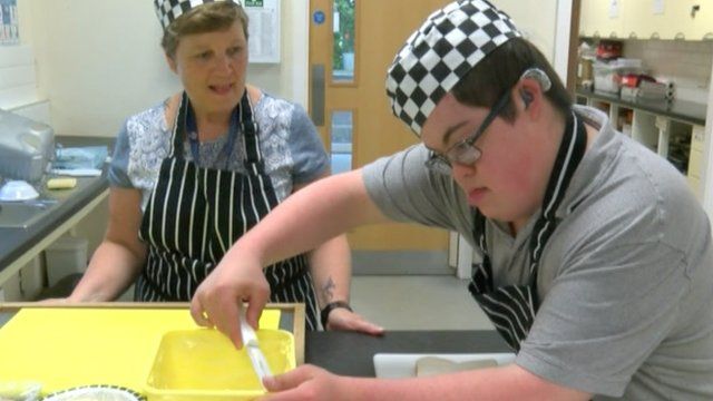 Young man working in kitchen