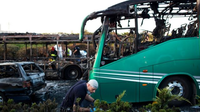 Israeli security officials investigate the scene following an explosion in Jerusalem
