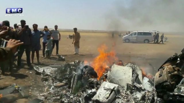 Still from Syrian rebel footage of Russian helicopter wreckage