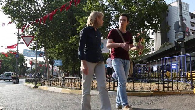 Bethany Bell talking to Ferhad Ercumen