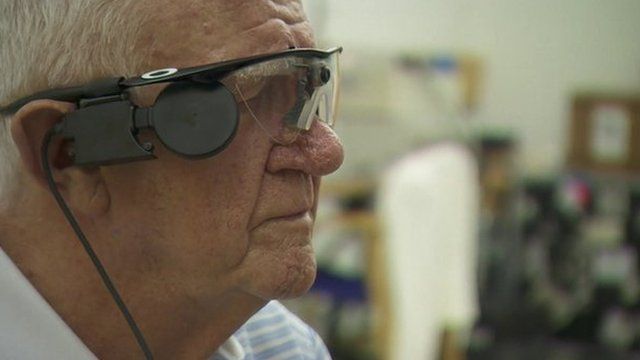 Visual signals from the camera on Ray's glasses are sent to the implant at the back of his retina