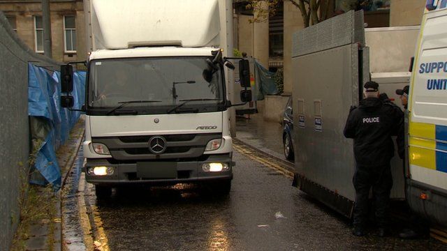 Police convoy leaves court