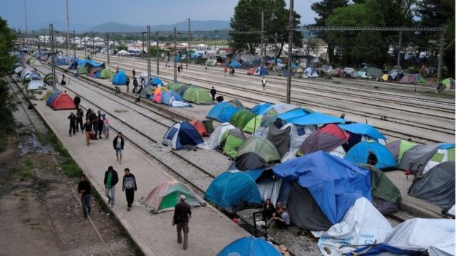 Migrants in tents at a train station in Greece