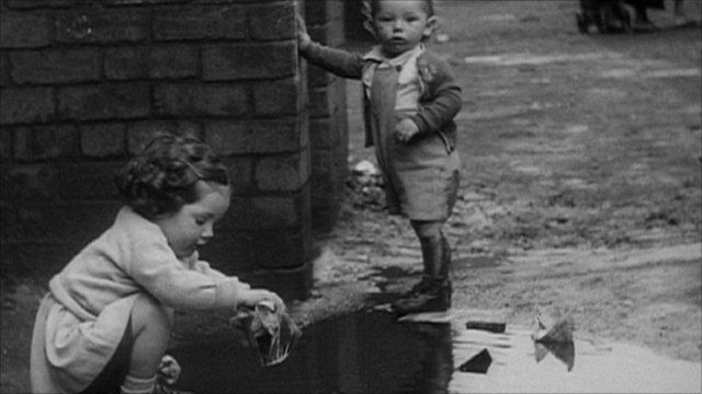 Black and white picture of toddlers playing