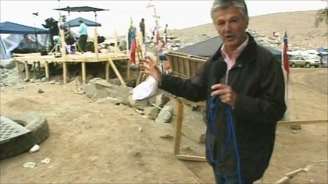The BBC's Tim Willcox points to the media tents at the Chile mine site