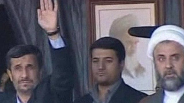Iran's President Mahmoud Ahmadinejad ( left) waves to the crowd
