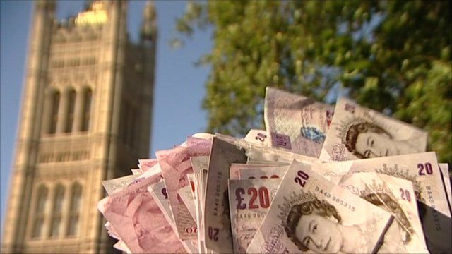 £20 notes in front of Parliament building
