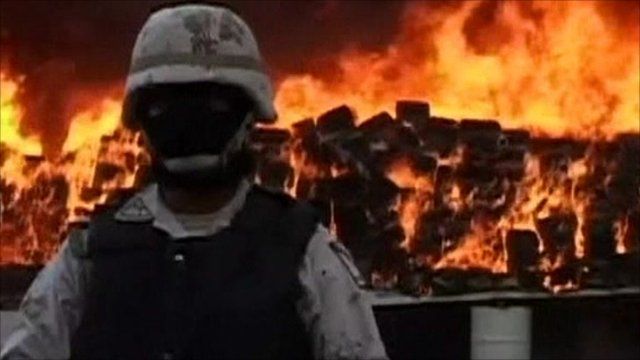 Army office in front of burning marijuana