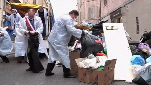 Council workers in Marseille clearing rubbish from streets