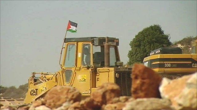 Palestinian digger in West Bank