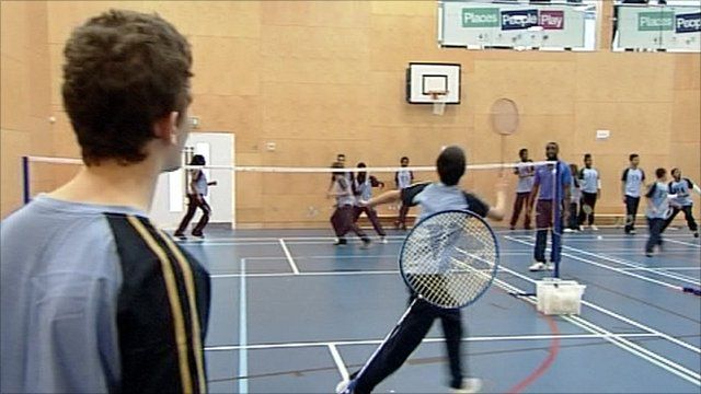 Young people playing badminton