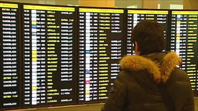 Passenger looking at information board