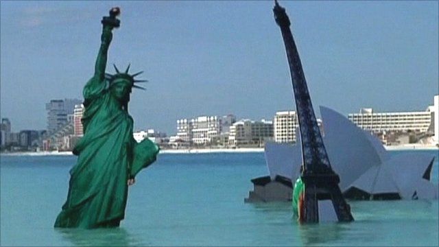 World landmarks symbolically drowning at global warming protest