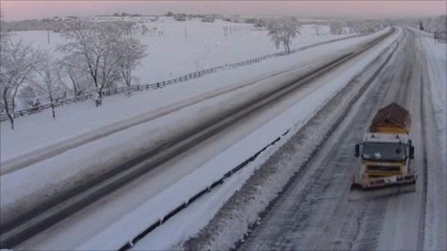 Snow plough on road