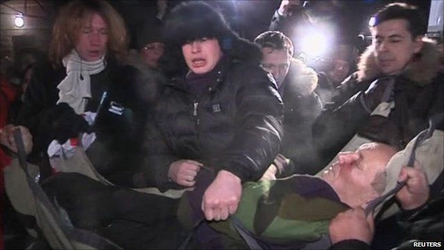Vladimir Neklyaev being lifted into an ambulance