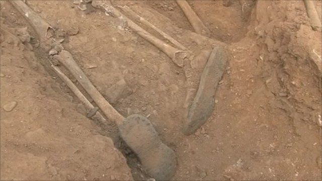 Skeleton in mass grave