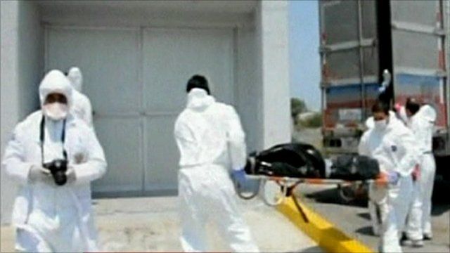 Men carrying a body bag on stretcher