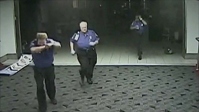CCTV shows security running for cover