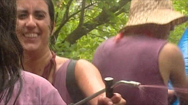 Woman fires red wine from a pump