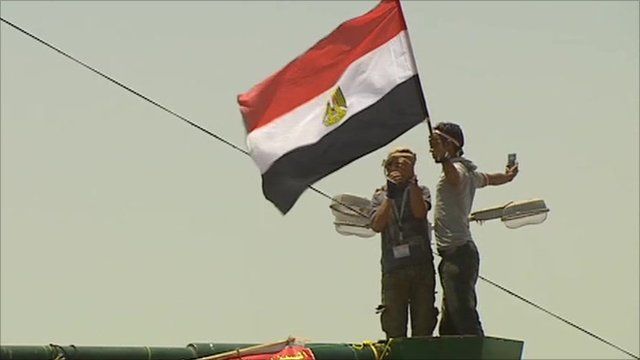 Protester holding Egyptian flag