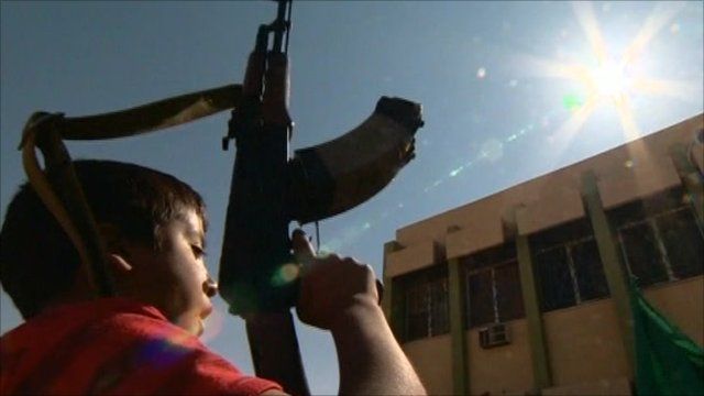 Rebel boy with gun