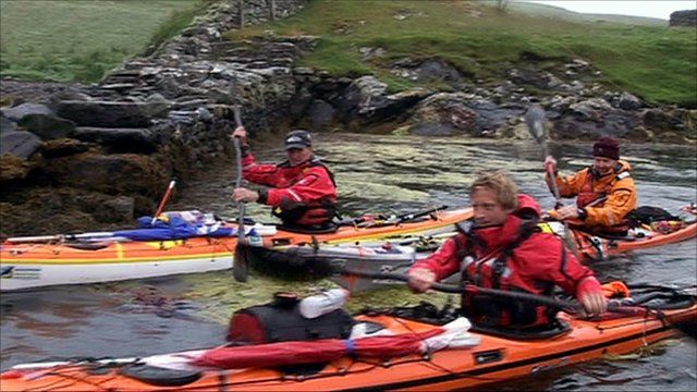 Men in kayaks