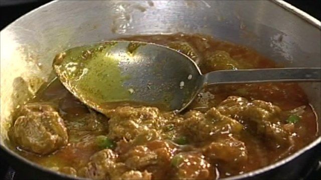 Pan of chicken tikka masala cooking