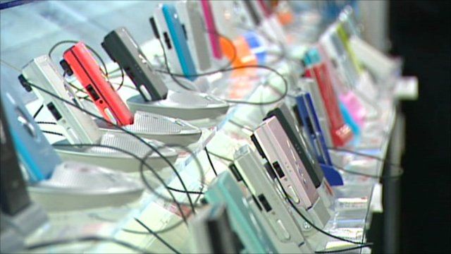 Rows of cameras on a shop shelf in Tokyo