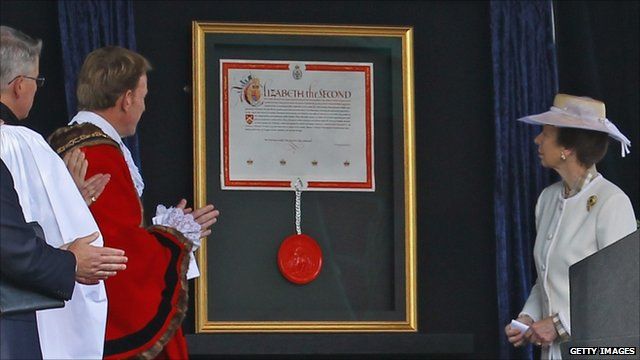 Princess Anne unveils the Royal patent