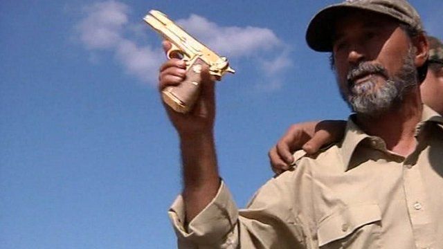 NTC fighter with 'Gaddafi's gun'