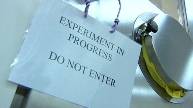Sign reading 'Experiment in progress, do not enter'