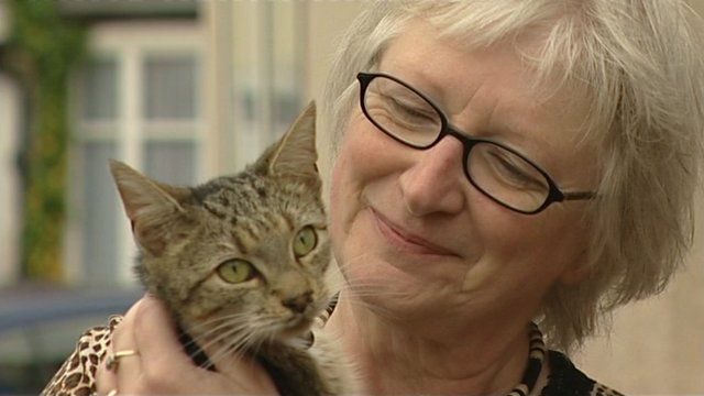 Beauty the cat with Sheila Bates