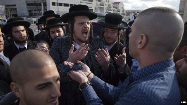 Secular Israelis argue with ultra-Orthodox Jewish protesters in the central town of Beit Shemesh