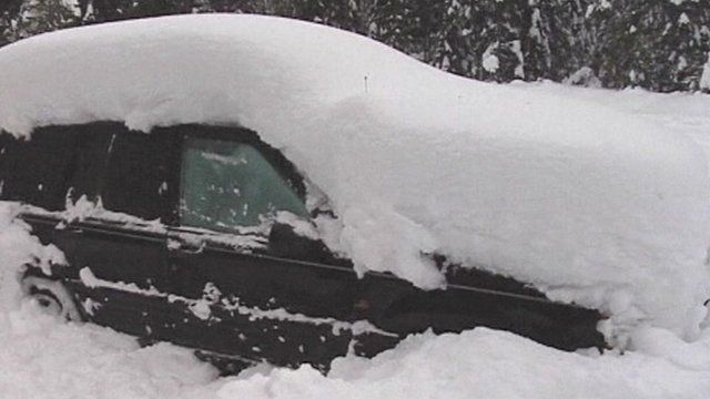 Trapped in snow covered car