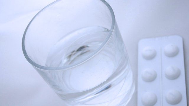 glass of water and pills