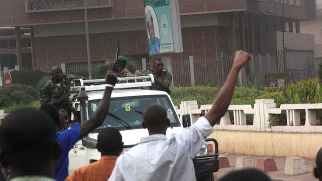 Civilians cheer as rebel soldiers drive past in Bamako, Mali