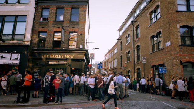 People outside a pub in Shoreditch