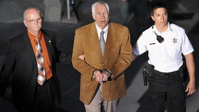 Jerry Sandusky leaves court in handcuffs