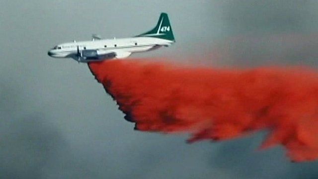 Plane dropping flame-retardant powder