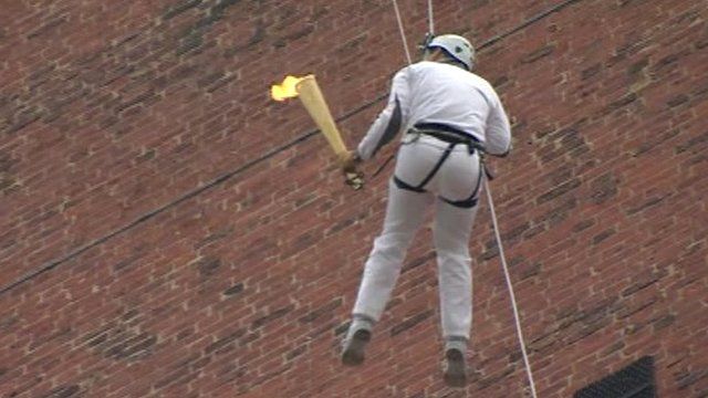 Olympic torch abseiled down Grimsby Dock Tower