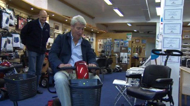 Jeremy Paxman on mobility scooter