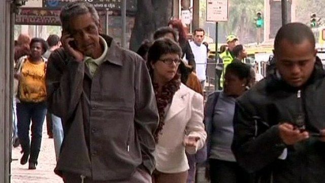 Mobile phone users on the streets of Brazil