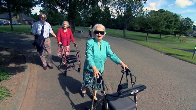 Lady using a walking aide